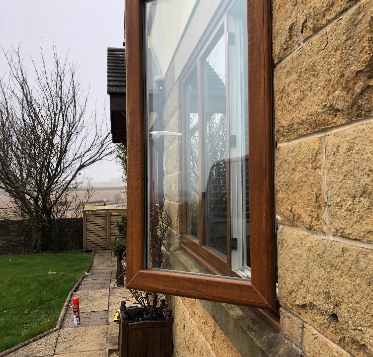 brown uPVC window Leeds